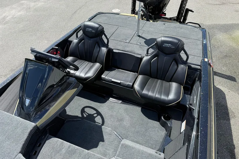 Slide: The Image of 2026 Skeeter ZXE21 boat interior with black leather seats and modern dashboard. - 12