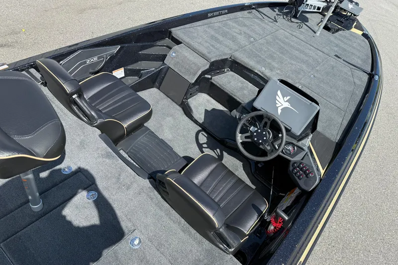 Slide: The Image of 2026 Skeeter ZXE21 boat interior with steering wheel, seats, and control panel. - 14