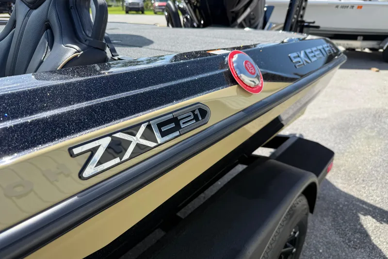 Slide: The Image of 2026 Skeeter ZXE21 boat, close-up of model badge and sleek design. - 7