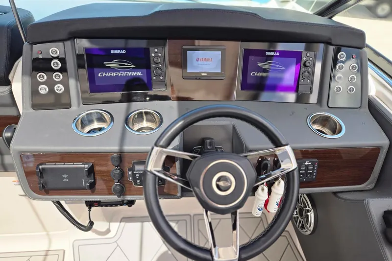 Slide: The Image of Dashboard of 2022 Chaparral 280 OSX boat with steering wheel and digital displays. - 10