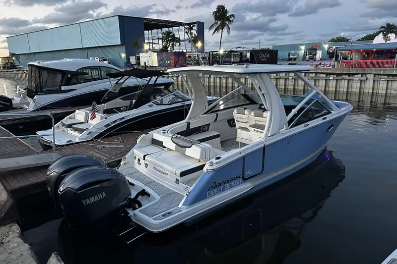 Slide: The Image of 2022 Chaparral 280 OSX boat docked with Yamaha engines, evening setting. - 28
