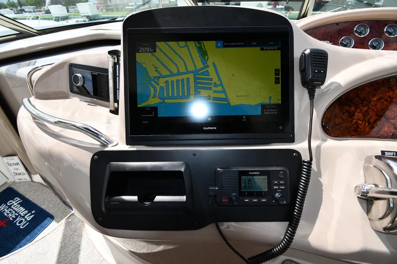 Slide: The Image of Control panel of a 2000 Sea Ray 460 Sundancer with Garmin navigation system. - 12