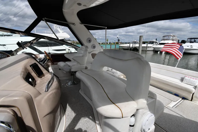 Slide: The Image of Interior view of a 2000 Sea Ray 460 Sundancer yacht with seating and helm. - 14