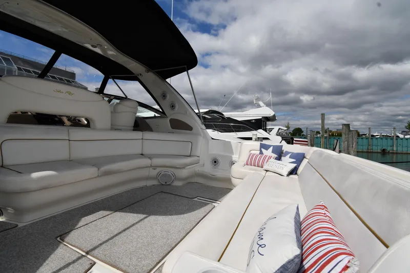 Slide: The Image of Luxurious 2000 Sea Ray 460 Sundancer yacht with spacious seating and decorative pillows. - 16