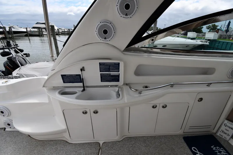 Slide: The Image of Interior view of a 2000 Sea Ray 460 Sundancer yacht with sink and storage cabinets. - 20