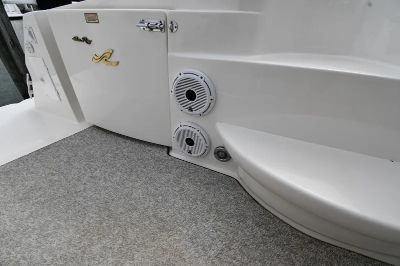 Slide: The Image of 2000 Sea Ray 460 Sundancer boat deck with speakers and carpeted flooring. - 25