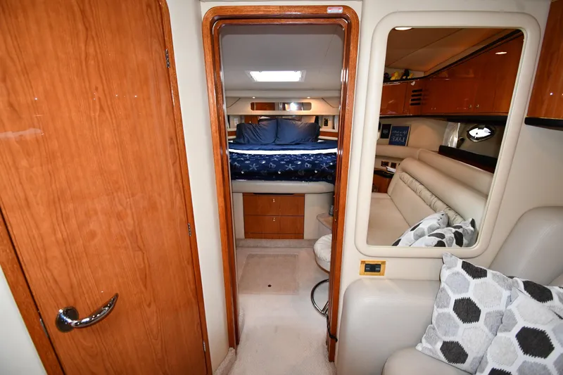 Slide: The Image of Luxurious interior of 2000 Sea Ray 460 Sundancer yacht with cozy bedroom and seating area. - 28