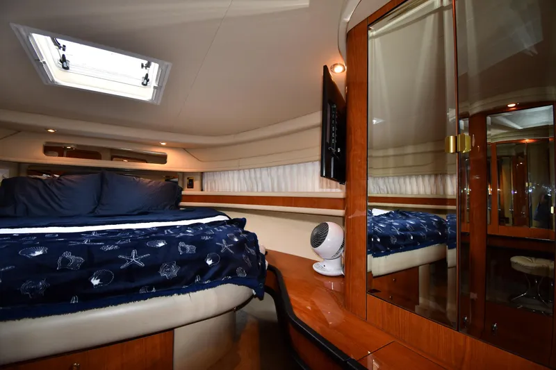 Slide: The Image of Luxurious cabin interior of 2000 Sea Ray 460 Sundancer yacht with elegant wood finishes. - 30