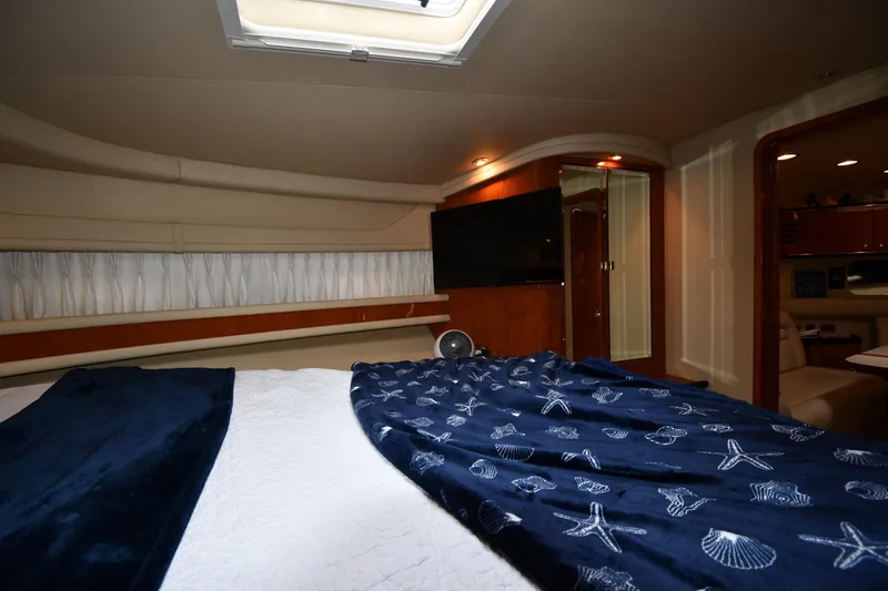 Slide: The Image of Luxurious interior of 2000 Sea Ray 460 Sundancer yacht with cozy bedroom. - 33