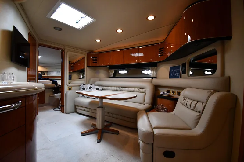 Slide: The Image of Luxurious interior of a 2000 Sea Ray 460 Sundancer yacht with plush seating and elegant wood finishes. - 37