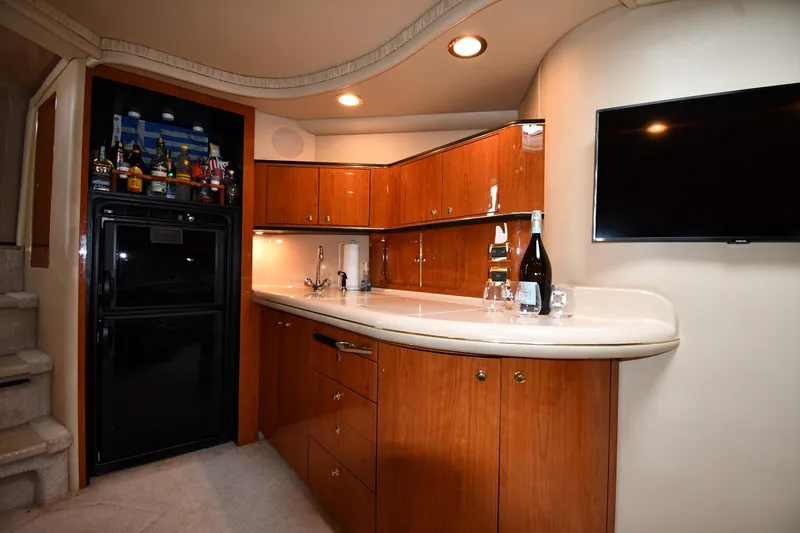 Slide: The Image of Luxurious interior of 2000 Sea Ray 460 Sundancer yacht with bar and TV. - 41