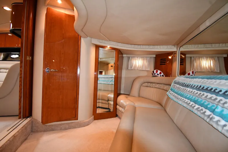 Slide: The Image of Luxurious interior of 2000 Sea Ray 460 Sundancer yacht with plush seating and elegant wood finishes. - 48