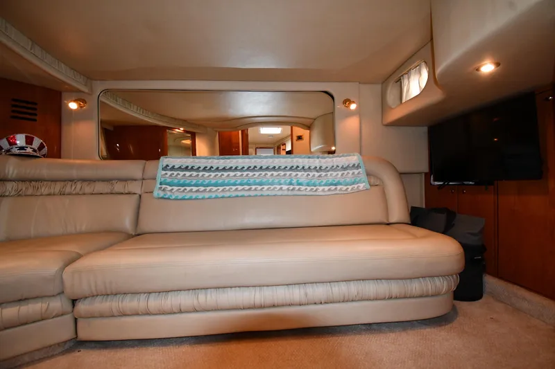 Slide: The Image of Luxurious interior of 2000 Sea Ray 460 Sundancer yacht with beige leather seating. - 50