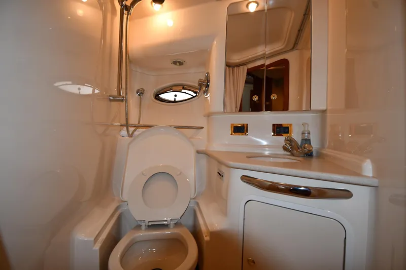 Slide: The Image of Bathroom interior of 2000 Sea Ray 460 Sundancer yacht, featuring toilet and sink. - 52