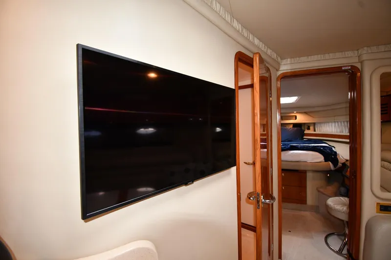 Slide: The Image of Interior of 2000 Sea Ray 460 Sundancer yacht with TV and cozy bedroom. - 53