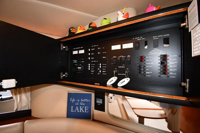 Slide: The Image of Control panel inside 2000 Sea Ray 460 Sundancer yacht with decorative rubber ducks. - 54