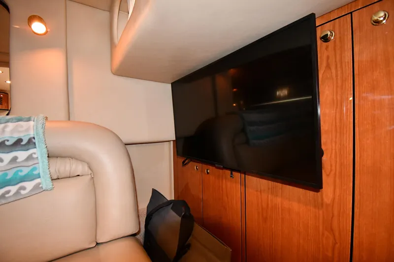 Slide: The Image of Interior of 2000 Sea Ray 460 Sundancer with TV and leather seating. - 55