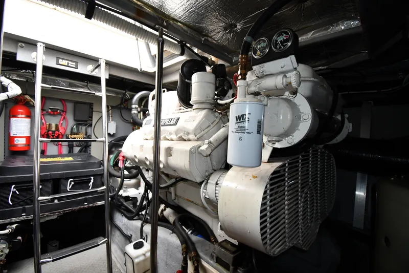 Slide: The Image of Engine room of 2000 Sea Ray 460 Sundancer with Caterpillar machinery and fire extinguisher. - 57
