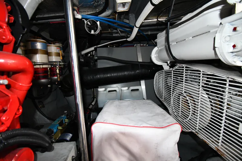 Slide: The Image of Engine room of a 2000 Sea Ray 460 Sundancer with visible components and machinery. - 59