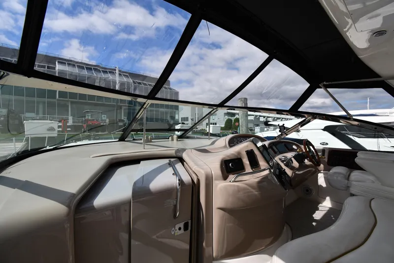 Slide: The Image of Interior view of 2000 Sea Ray 460 Sundancer yacht cockpit with modern controls. - 9