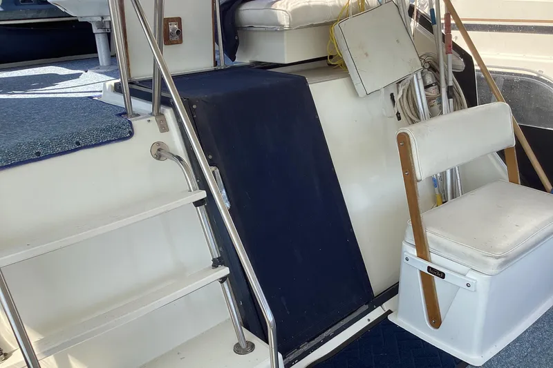 Slide: The Image of 1989 Sea Ray 380 Aft Cabin interior with stairs and seating area. - 5