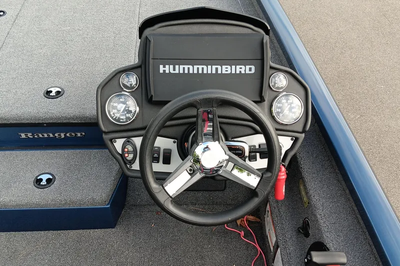 Slide: The Image of 2021 Ranger RT188P boat dashboard with Humminbird display and steering wheel. - 11