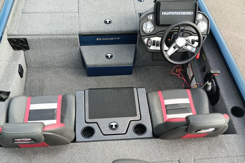 Slide: The Image of 2021 Ranger RT188P boat interior with steering wheel, seats, and Humminbird electronics. - 12