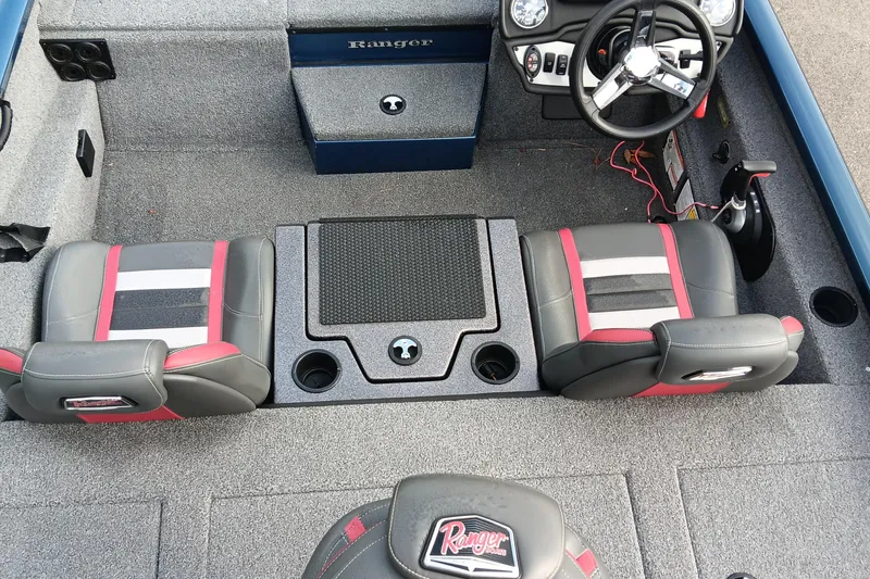 Slide: The Image of 2021 Ranger RT188P boat interior with dual seats, steering wheel, and control panel. - 13