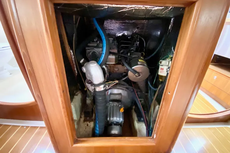 Slide: The Image of Engine compartment of a 2003 Hunter 386 sailboat, showcasing mechanical components. - 39