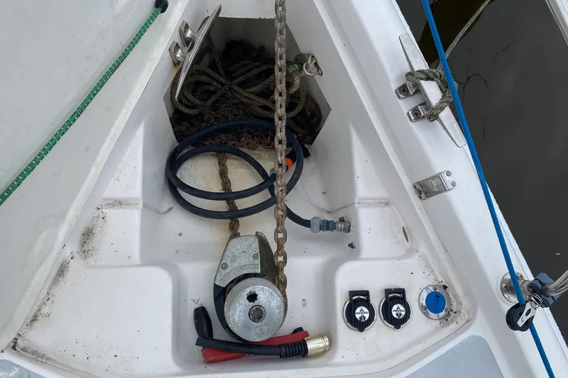 Slide: The Image of Anchor locker of 2003 Hunter 386 sailboat with chain, rope, and winch. - 47