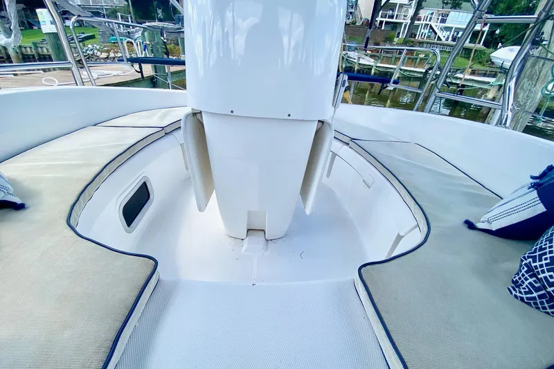 Slide: The Image of 2003 Hunter 386 sailboat cockpit with cushioned seating and nautical decor. - 57