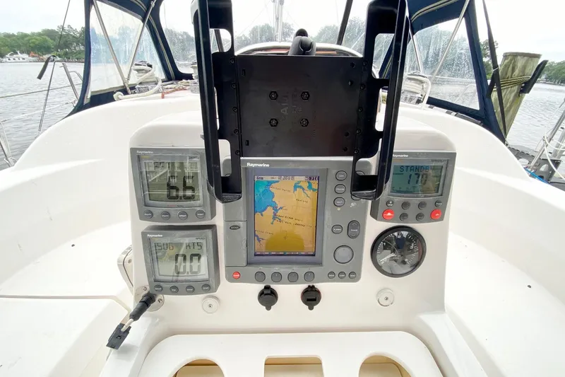 Slide: The Image of Cockpit of 2003 Hunter 386 sailboat with navigation instruments and GPS display. - 62