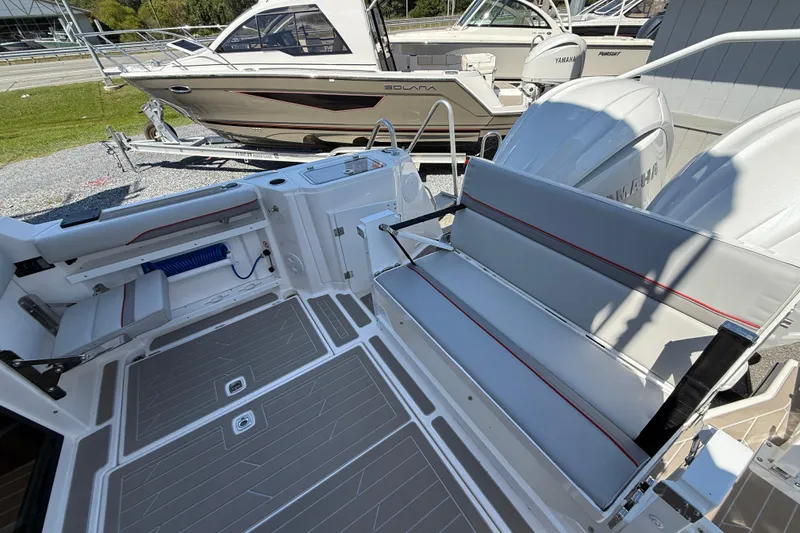 Slide: The Image of 2026 Solara S-310 SB boat interior with seating and Yamaha engines. - 13
