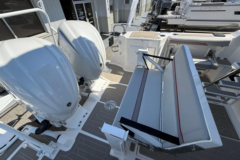 Slide: The Image of 2026 Solara S-310 SB boat with dual engines and foldable seating. - 14