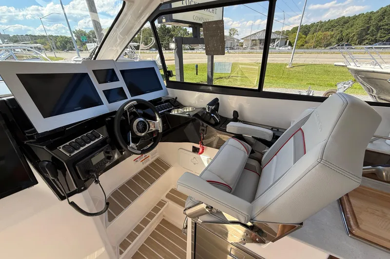 Slide: The Image of 2026 Solara S-310 SB boat cockpit with modern controls and comfortable seating. - 16