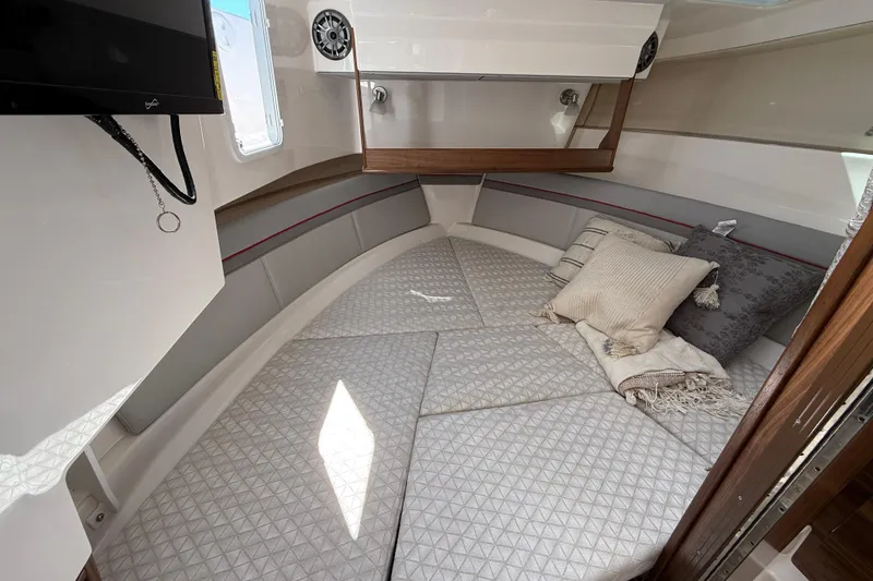 Slide: The Image of Luxurious interior cabin of 2026 Solara S-310 SB boat with cozy bedding. - 20