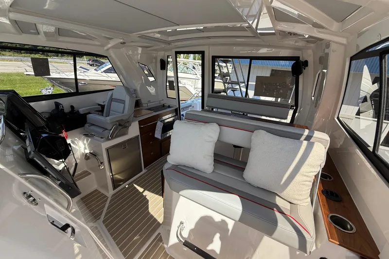 Slide: The Image of Interior of 2026 Solara S-310 SB boat with seating and helm station. - 26
