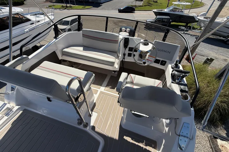 Slide: The Image of 2026 Solara S-310 SB boat cockpit with modern seating and navigation equipment. - 27