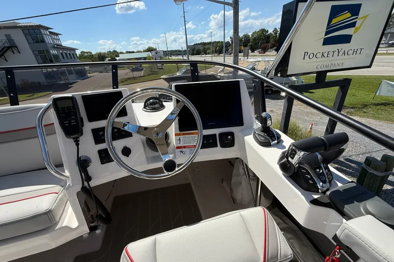 Slide: The Image of Helm of 2026 Solara S-310 SB boat with modern controls and steering wheel. - 28