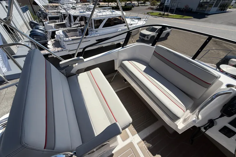 Slide: The Image of 2026 Solara S-310 SB boat interior with sleek seating and modern design. - 29