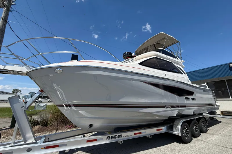 Slide: The Image of 2026 Solara S-310 SB boat on trailer under clear blue sky. - 5