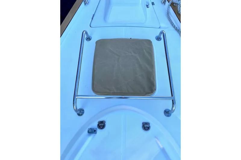 Slide: The Image of Deck of 1997 Beneteau Oceanis 461 sailboat with cushioned seat and metal railing. - 11
