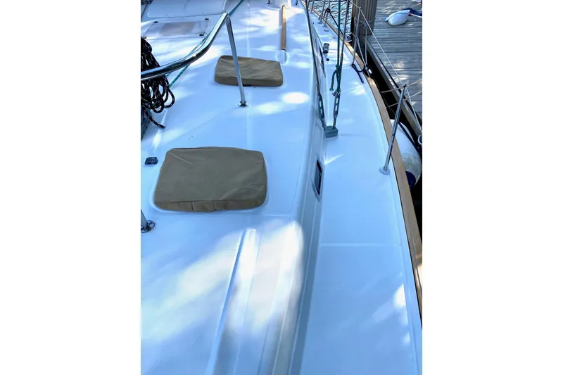 Slide: The Image of Deck view of a 1997 Beneteau Oceanis 461 sailboat, featuring clean lines and dockside setting. - 13