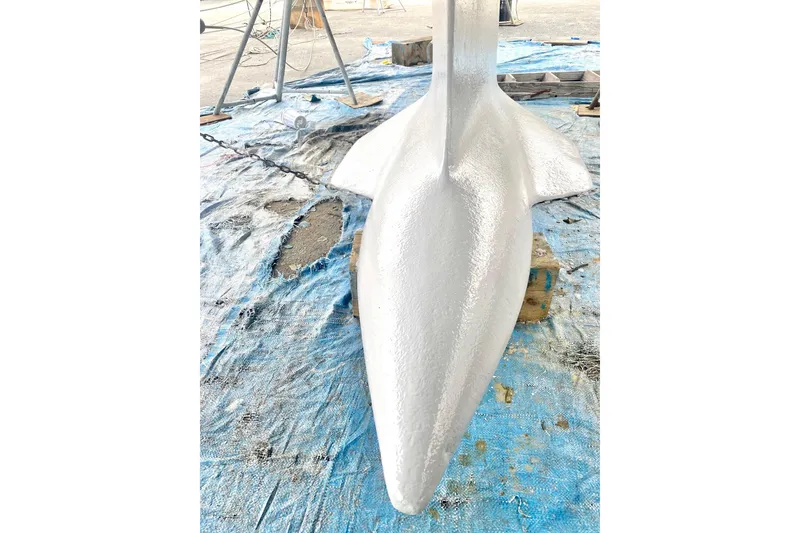 Slide: The Image of Close-up of a 1997 Beneteau Oceanis 461 keel on a blue tarp. - 18