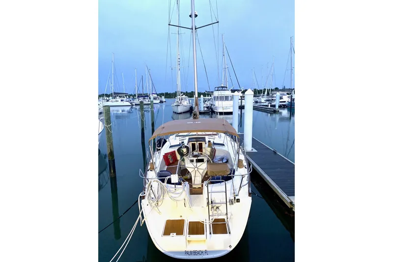 Slide: The Image of 1997 Beneteau Oceanis 461 sailboat docked at marina, evening view. - 2