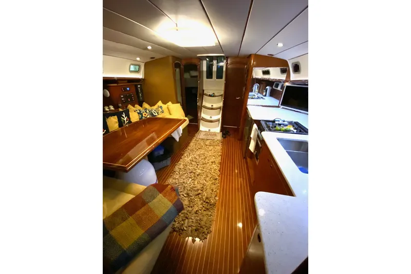 Slide: The Image of Interior of 1997 Beneteau Oceanis 461 yacht with cozy seating and modern kitchen. - 23