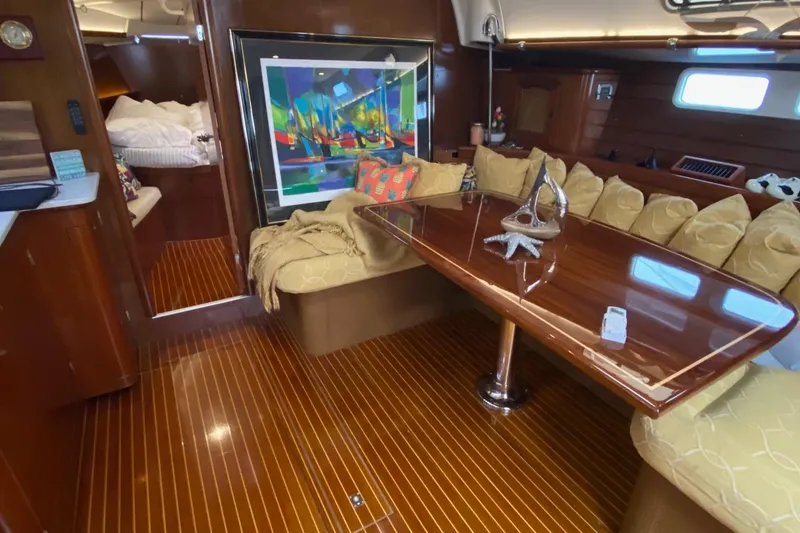 Slide: The Image of Luxurious interior of 1997 Beneteau Oceanis 461 yacht with polished wood and cozy seating. - 27