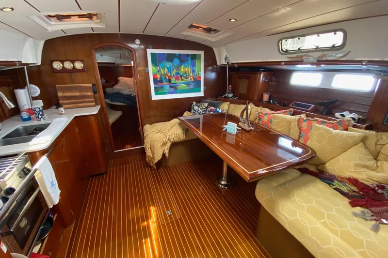 Slide: The Image of Luxurious interior of 1997 Beneteau Oceanis 461 yacht with cozy seating and elegant wood finishes. - 28