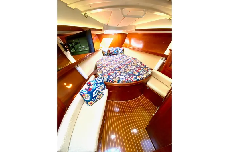 Slide: The Image of Cozy cabin interior of 1997 Beneteau Oceanis 461 with floral bedding and wood finish. - 39