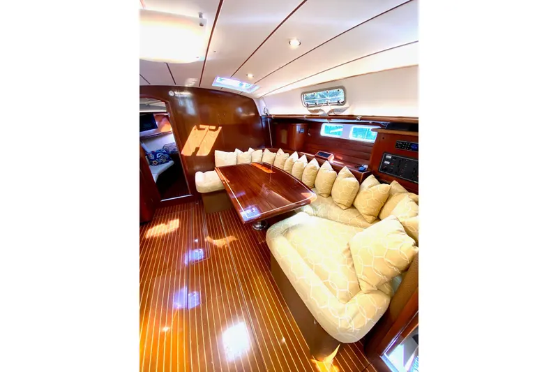 Slide: The Image of Luxurious interior of 1997 Beneteau Oceanis 461 yacht with elegant wood finish and plush seating. - 41
